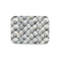 Memory foam bath mat with a photorealistic grey and white herringbone woven texture print for a modern bathroom.