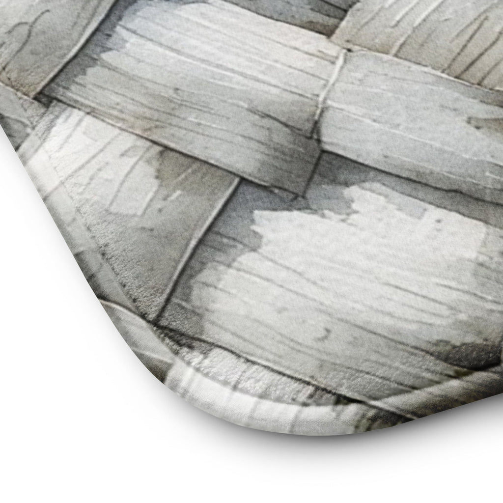 Close-up of Memory foam bath mat with a photorealistic grey and white herringbone woven texture print for a modern bathroom.