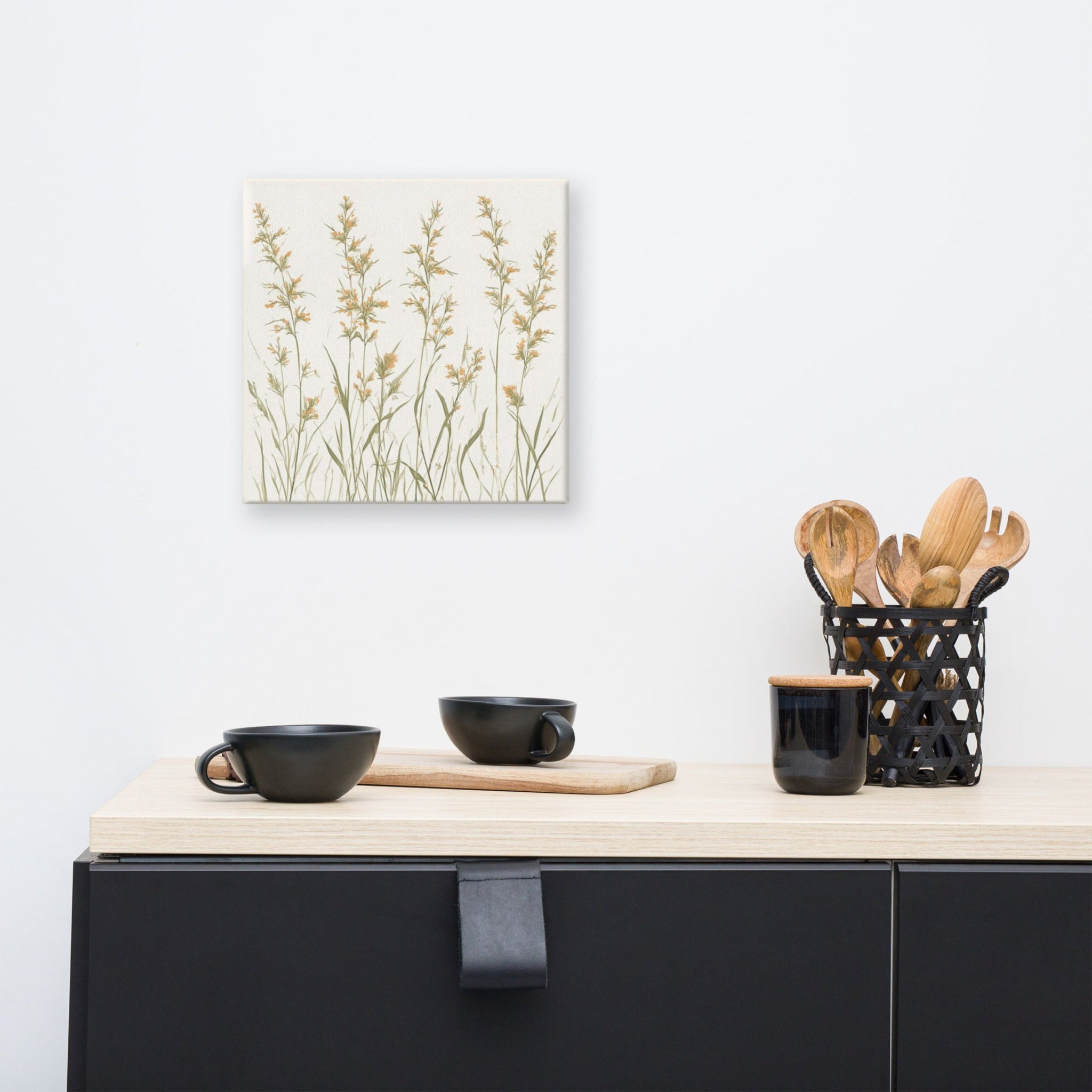 A square canvas print featuring minimalist illustrations of delicate, neutral-toned meadow grasses and wildflower stems on a cream background