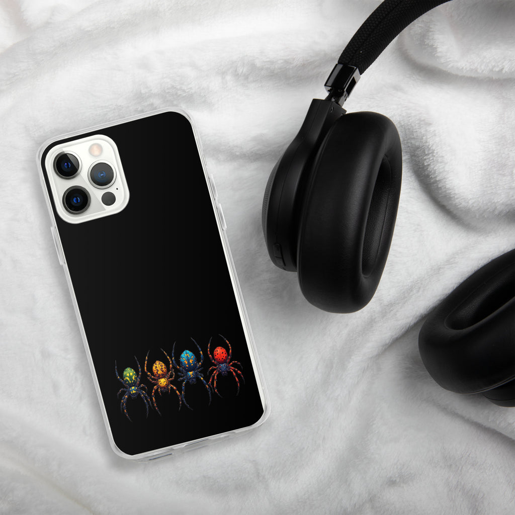 A black phone case with a colorful spider graphic, shown on a smartphone next to black headphones on a white textured blanket background.