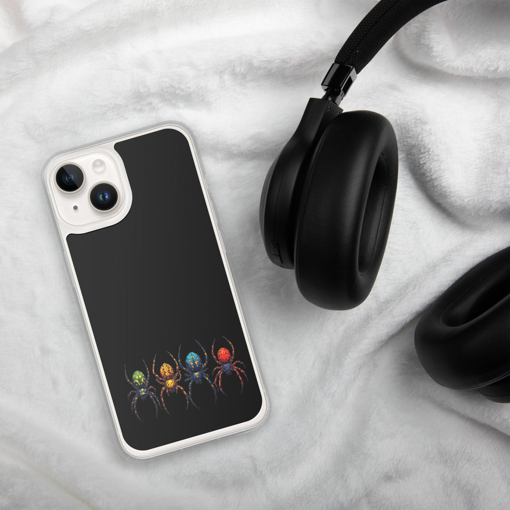 A smartphone case with a black back and a colorful spider print near the bottom, shown on a white plush blanket next to black headphones.