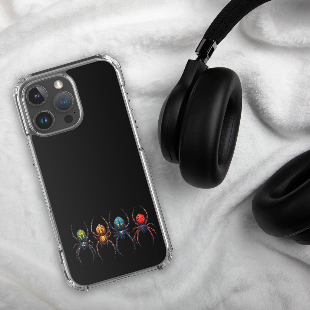 Phone case with colorful spider pattern on black background next to black headphones on white fabric