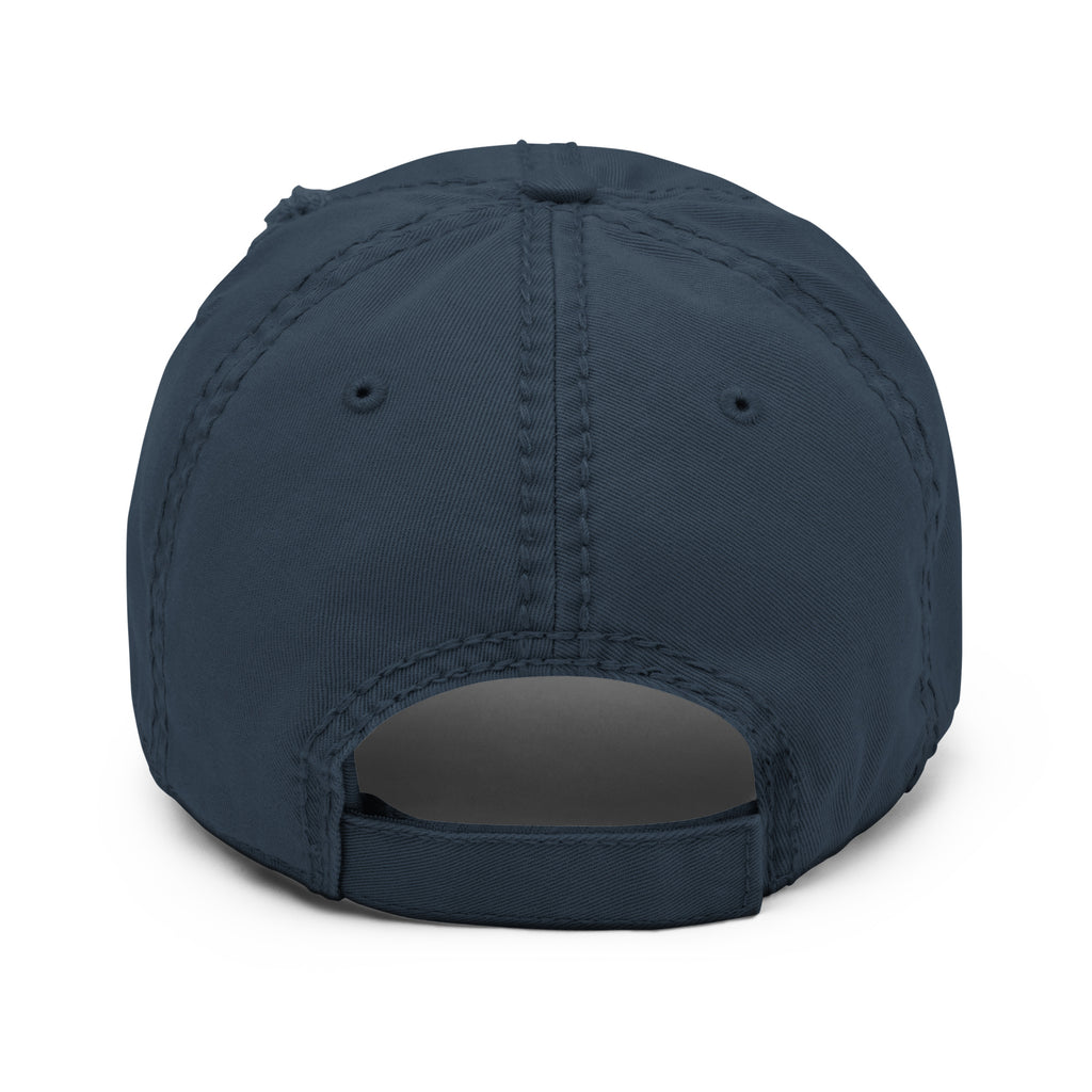 The back strap of a Distressed dad hat with full-color fisherman in a boat lake scene graphic printed on the front panel, navy blue color, structured low-profile cap with adjustable back strap. 