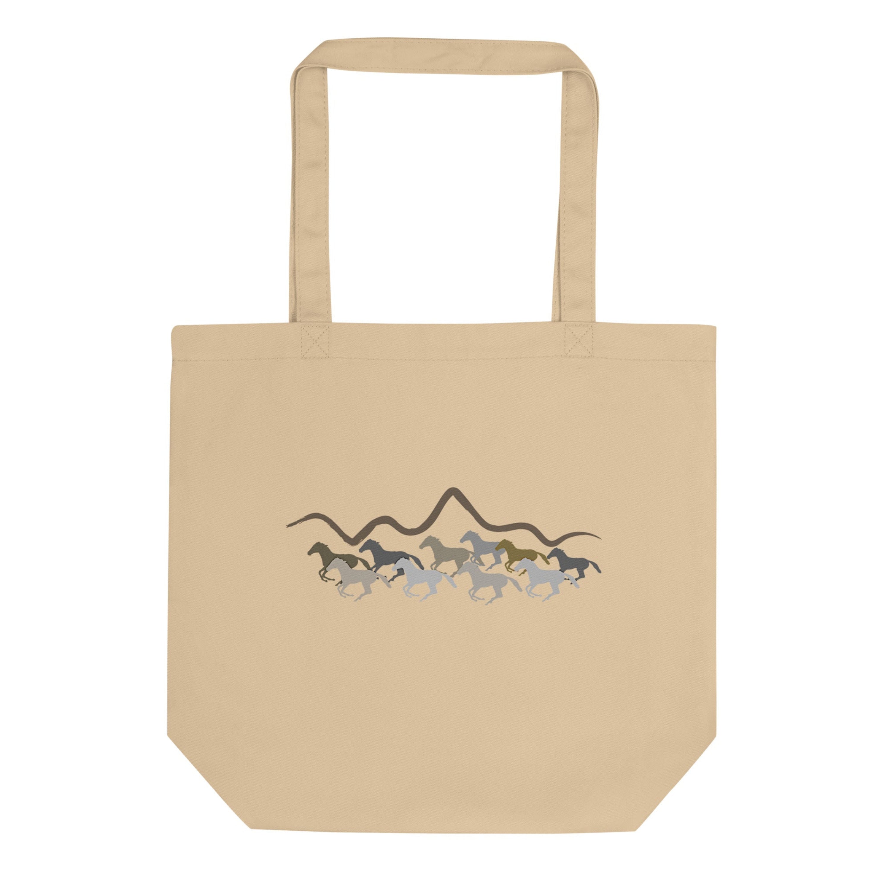 Beige tote bag with horse design on a white background.
