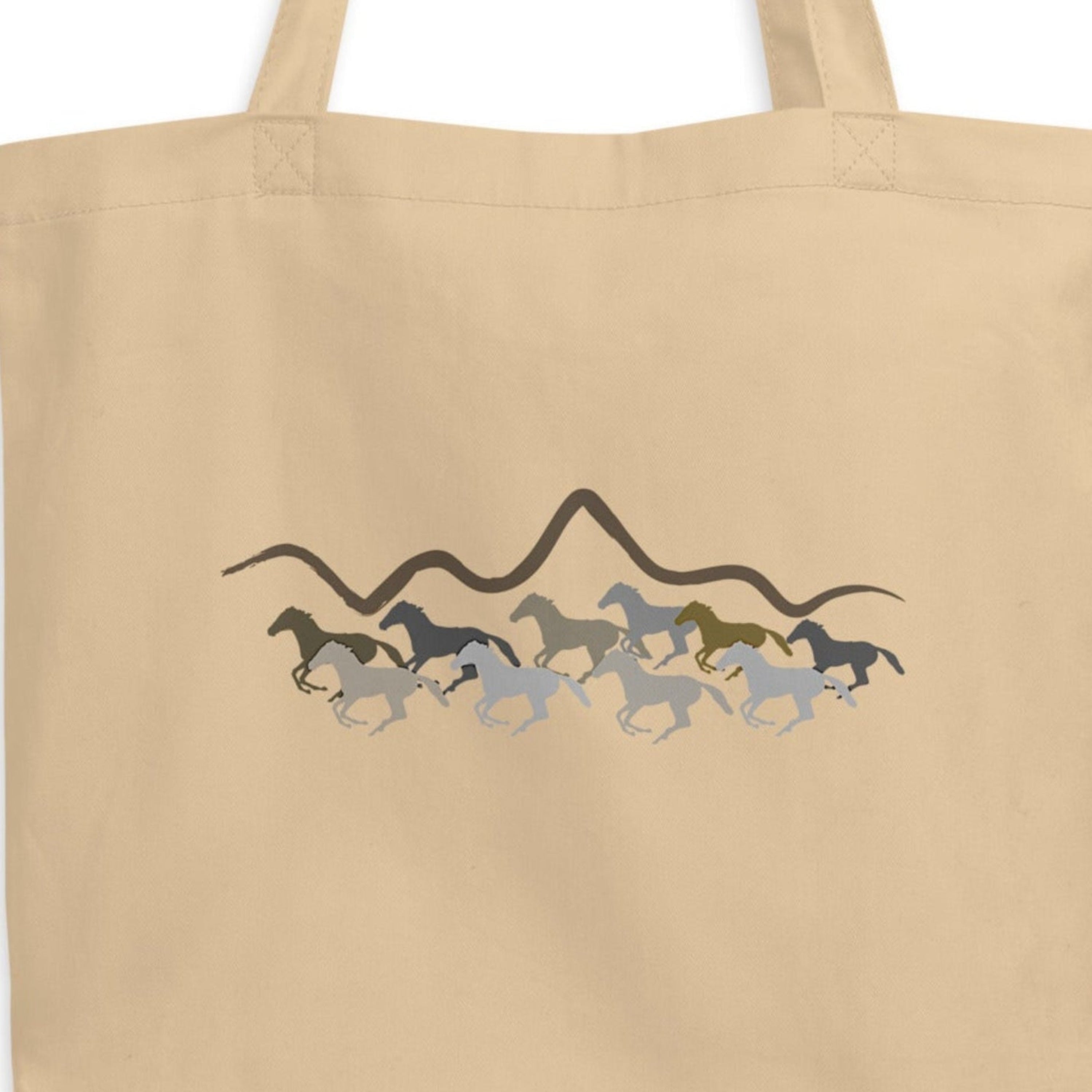 Beige tote bag with horse design on a white background.
