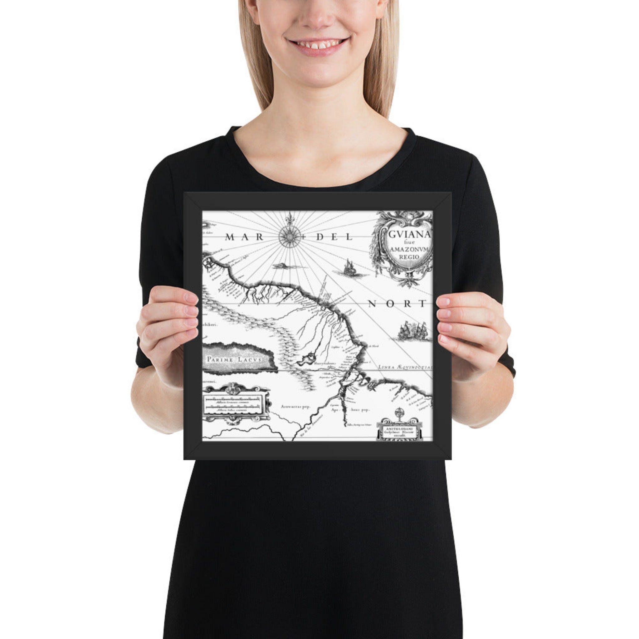 Person holding a framed black and white map