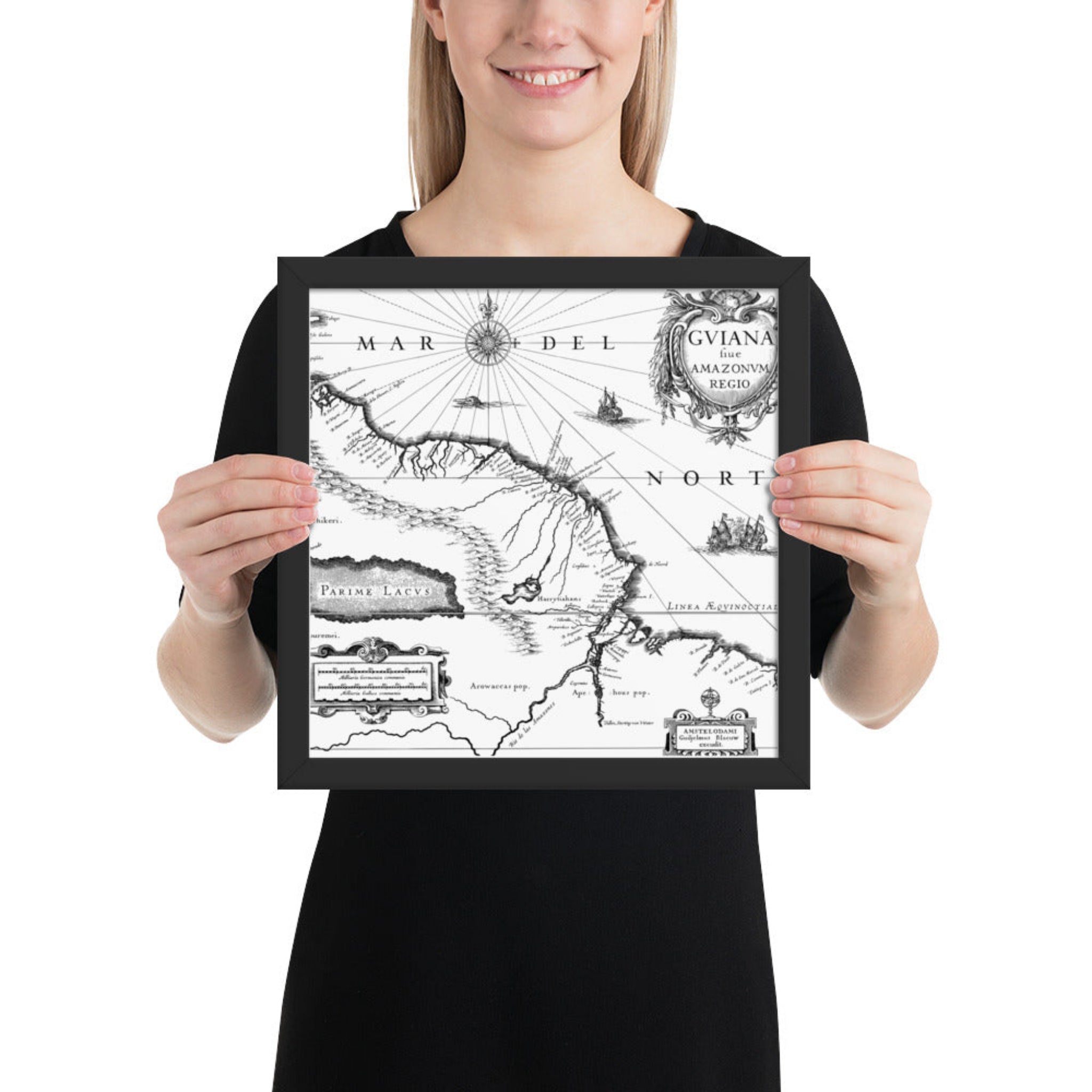 Person holding a framed black and white map