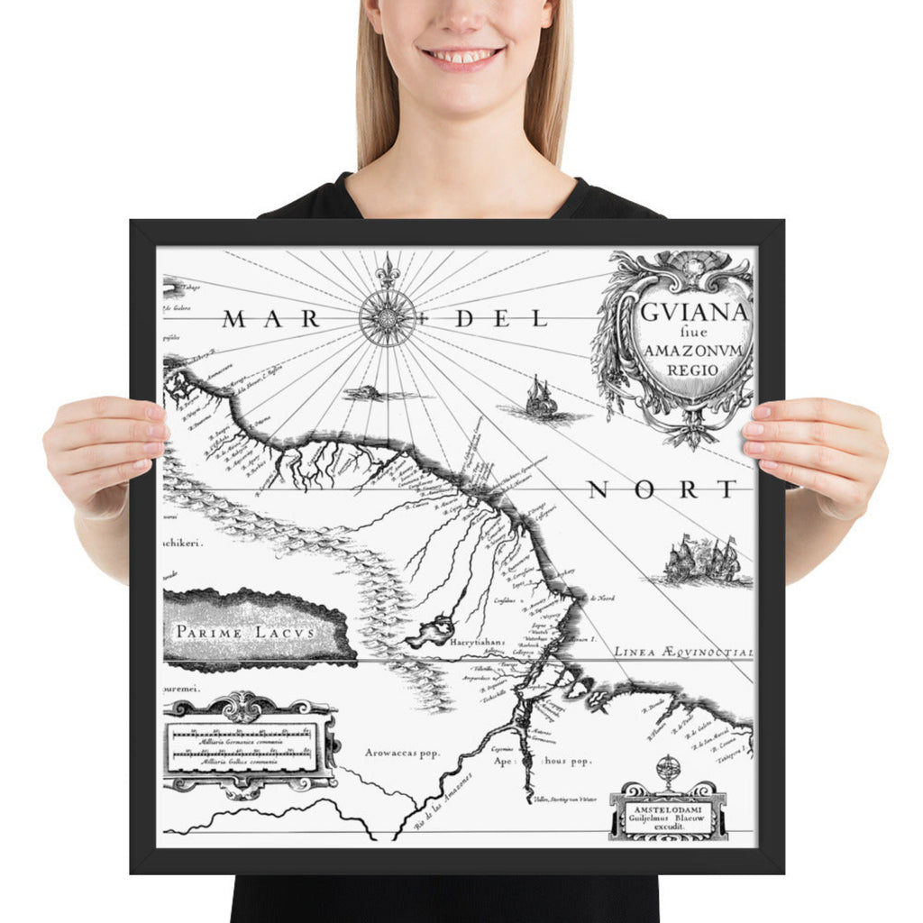 Person holding a framed vintage map of South America