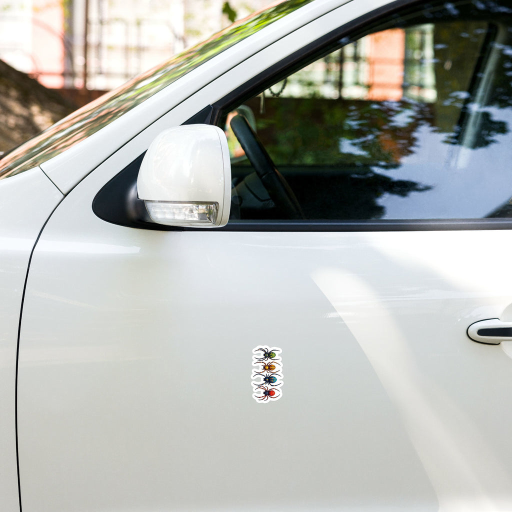White car with a colorful sticker on the side.