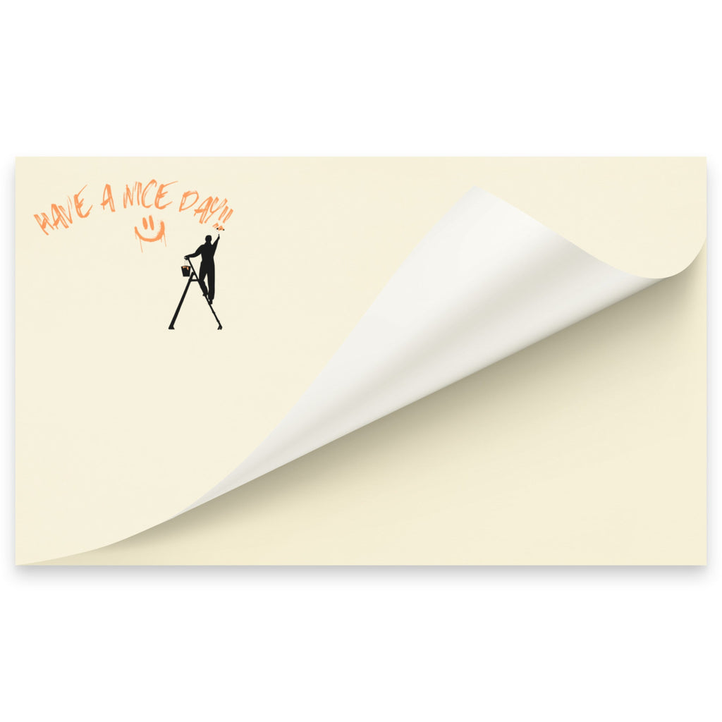 Beige post it sticky note pad with black silhouette and text 'Have a nice day' on a white background