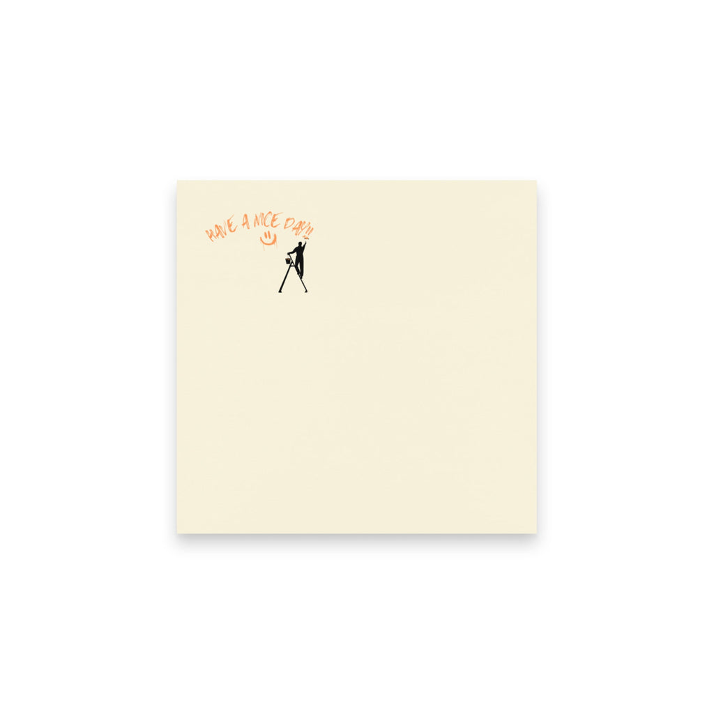 Beige post it note with black silhouette and text 'Have a nice day' on a white background