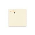 Beige post it note with black silhouette and text 'Have a nice day' on a white background