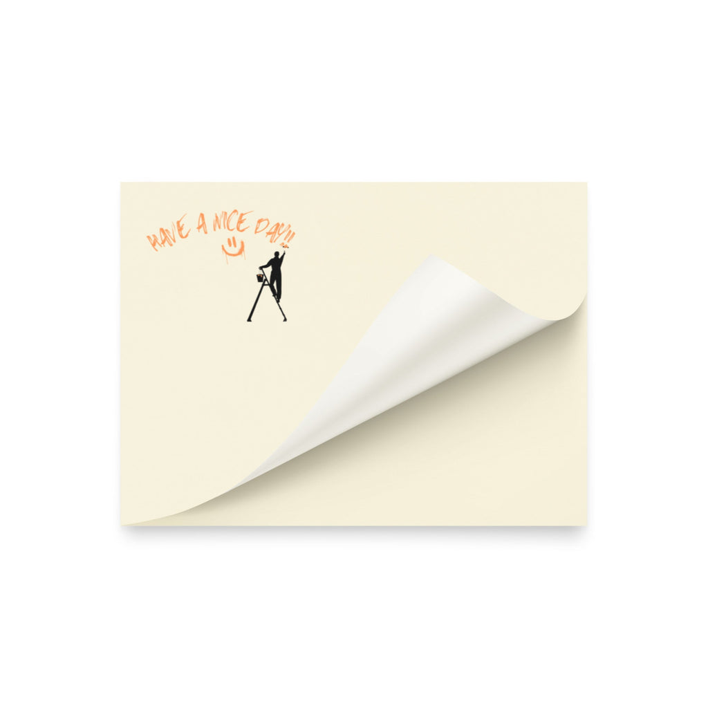 Beige post it sticky note pad with black silhouette and text 'Have a nice day' on a white background