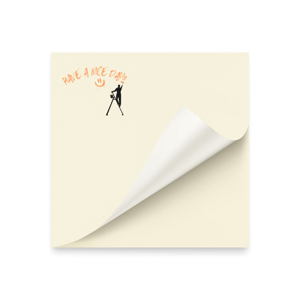 Beige post it sticky note pad with black silhouette and text 'Have a nice day' on a white background