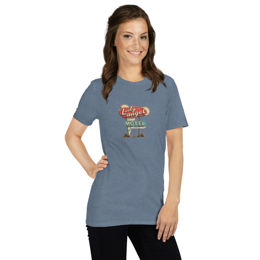 Woman wearing a blue t-shirt with a vintage motel sign design on a white background.