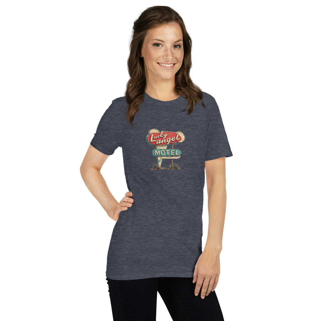 Woman wearing a blue t-shirt with a vintage motel sign design on a white background.