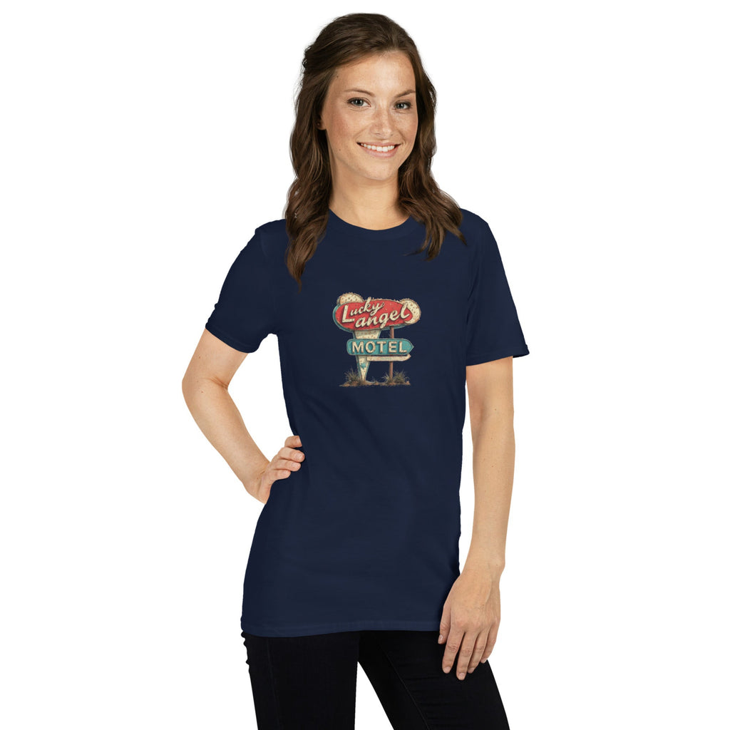 Woman wearing a navy blue t-shirt with a vintage motel sign design on a white background.
