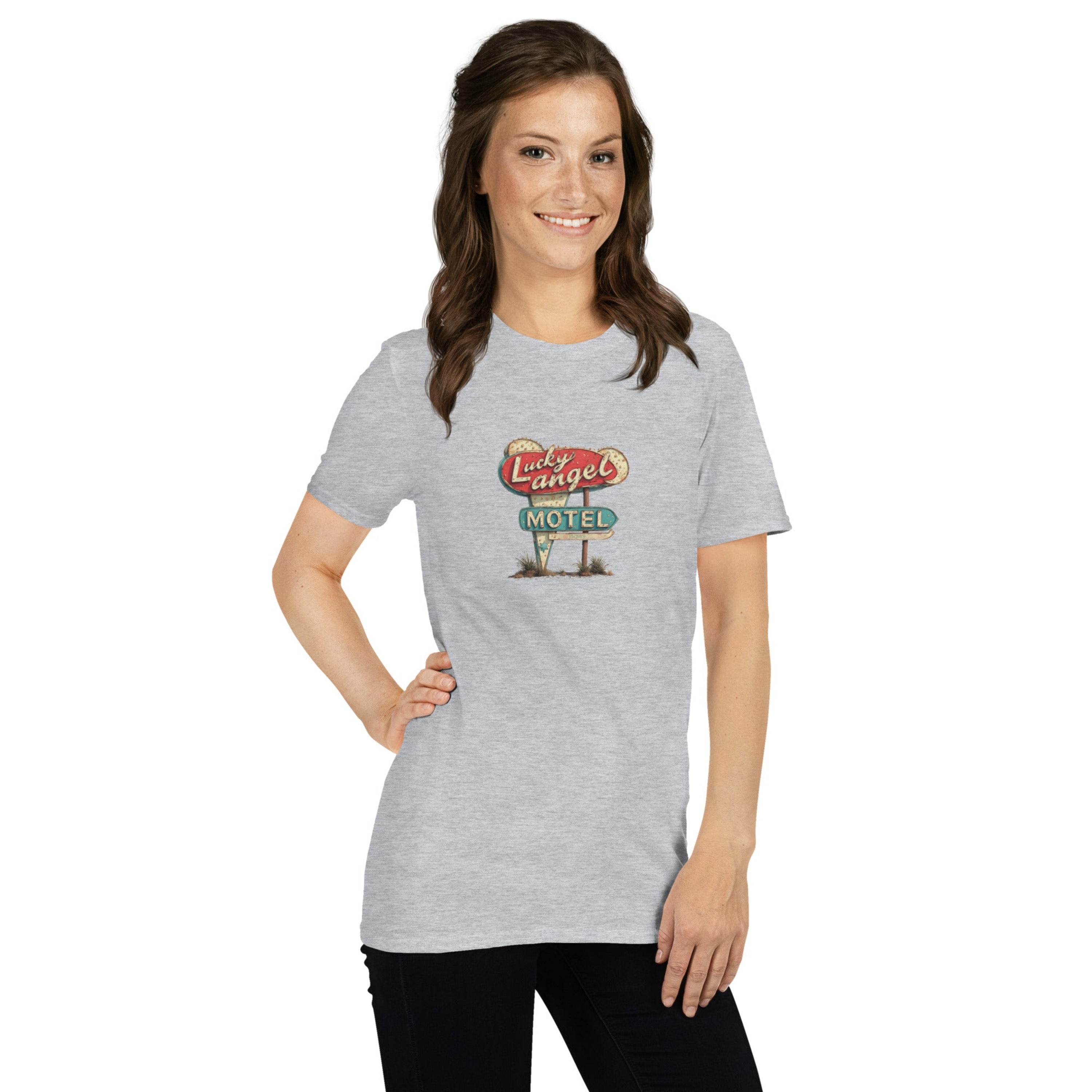Woman wearing a gray t-shirt with a vintage motel sign graphic on a white background.