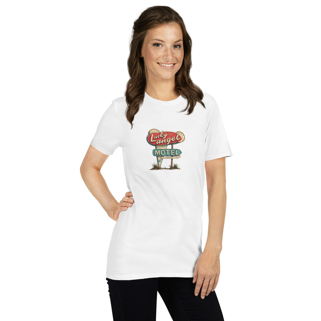 Woman wearing a white t-shirt with a vintage motel sign graphic on a white background.