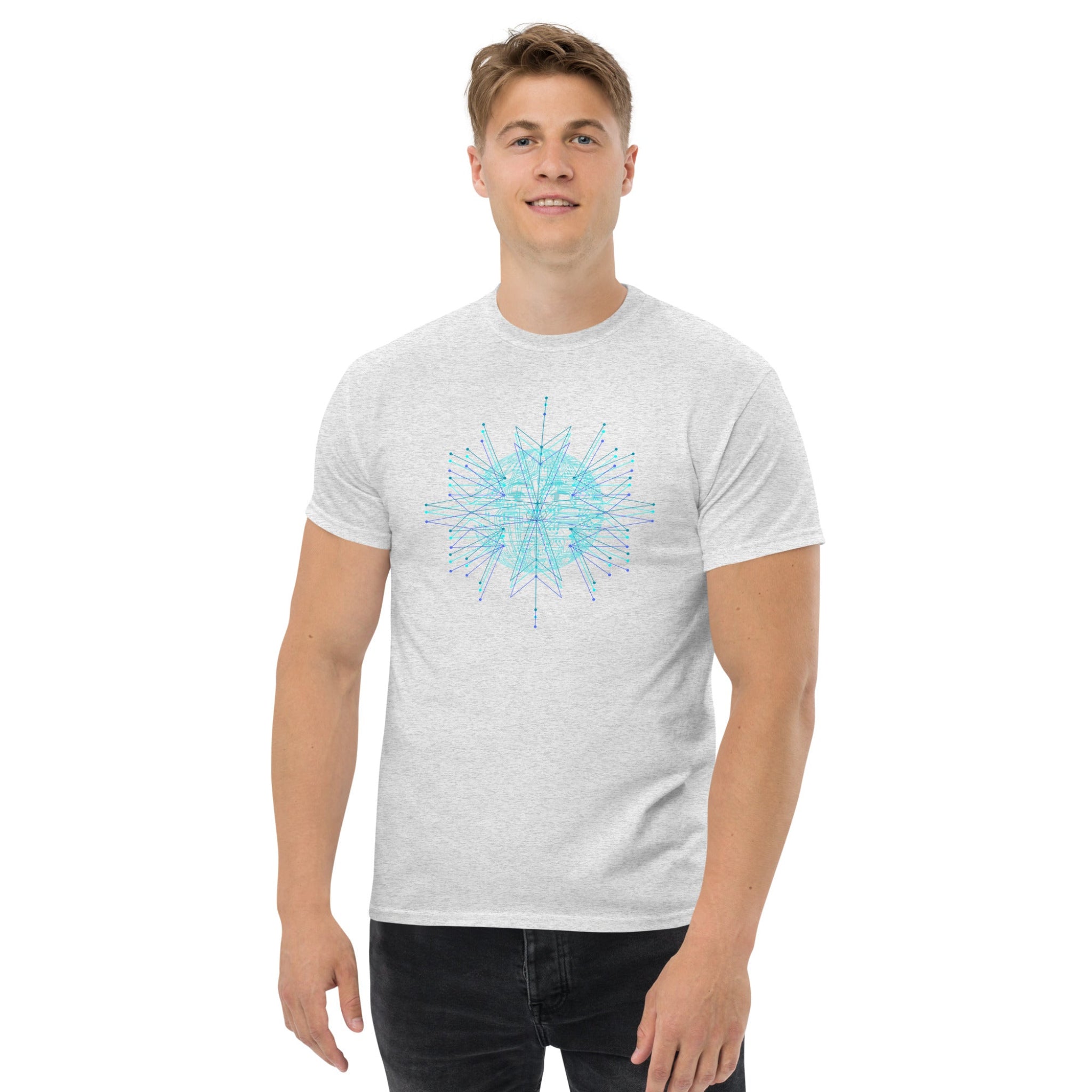 Man wearing a gray t-shirt with a blue geometric design on a white background