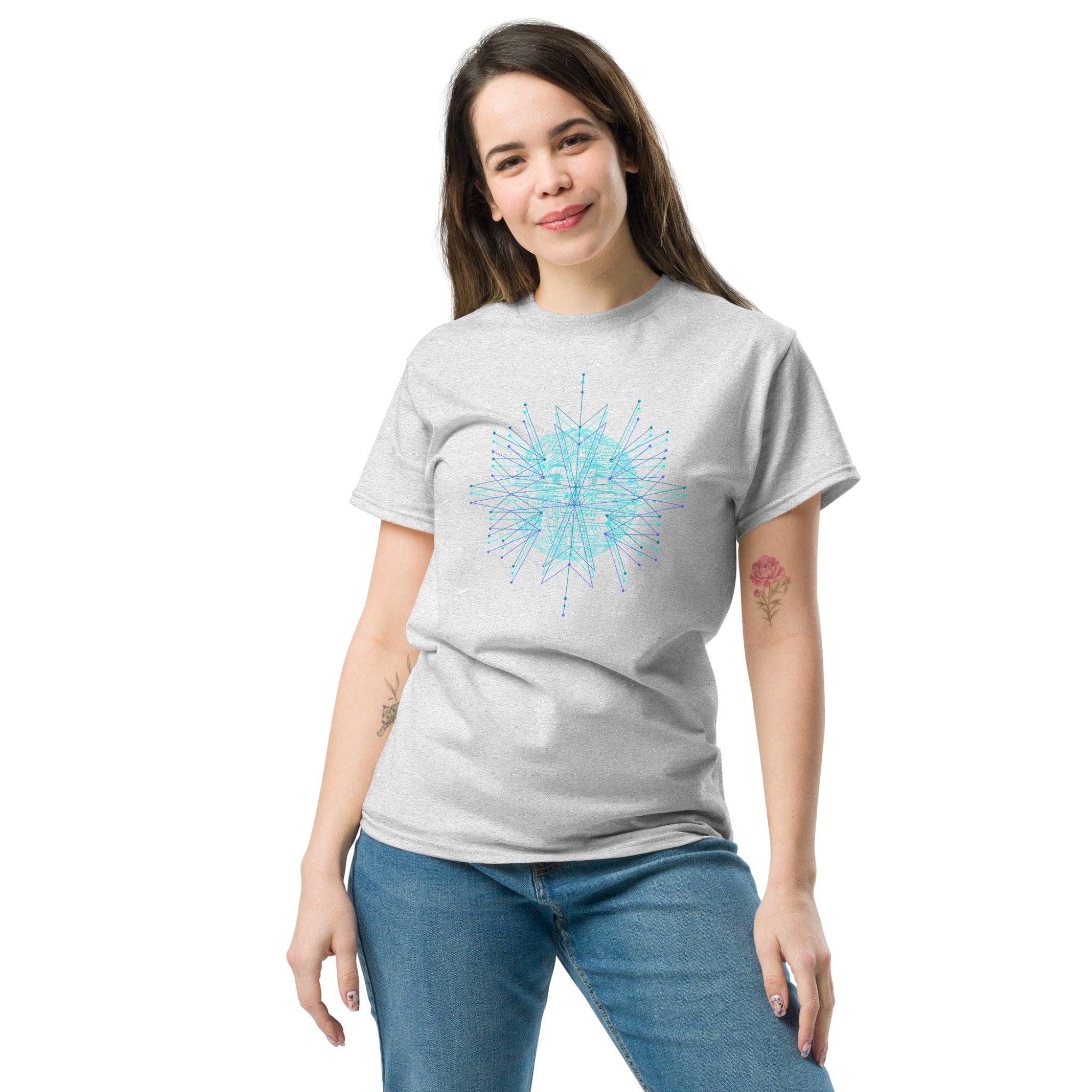 Woman wearing a gray t-shirt with a blue geometric design on a white background