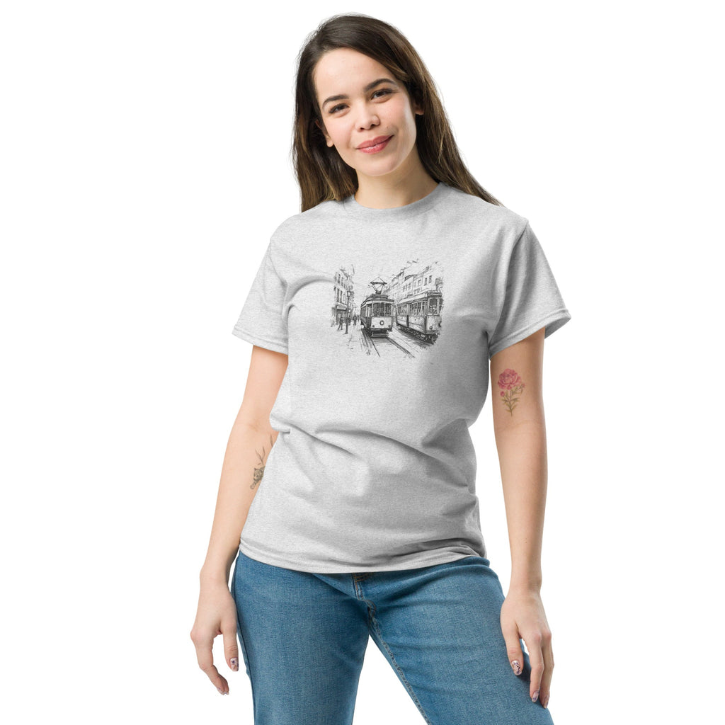 Woman wearing a gray t-shirt with a tram sketch design on a white background