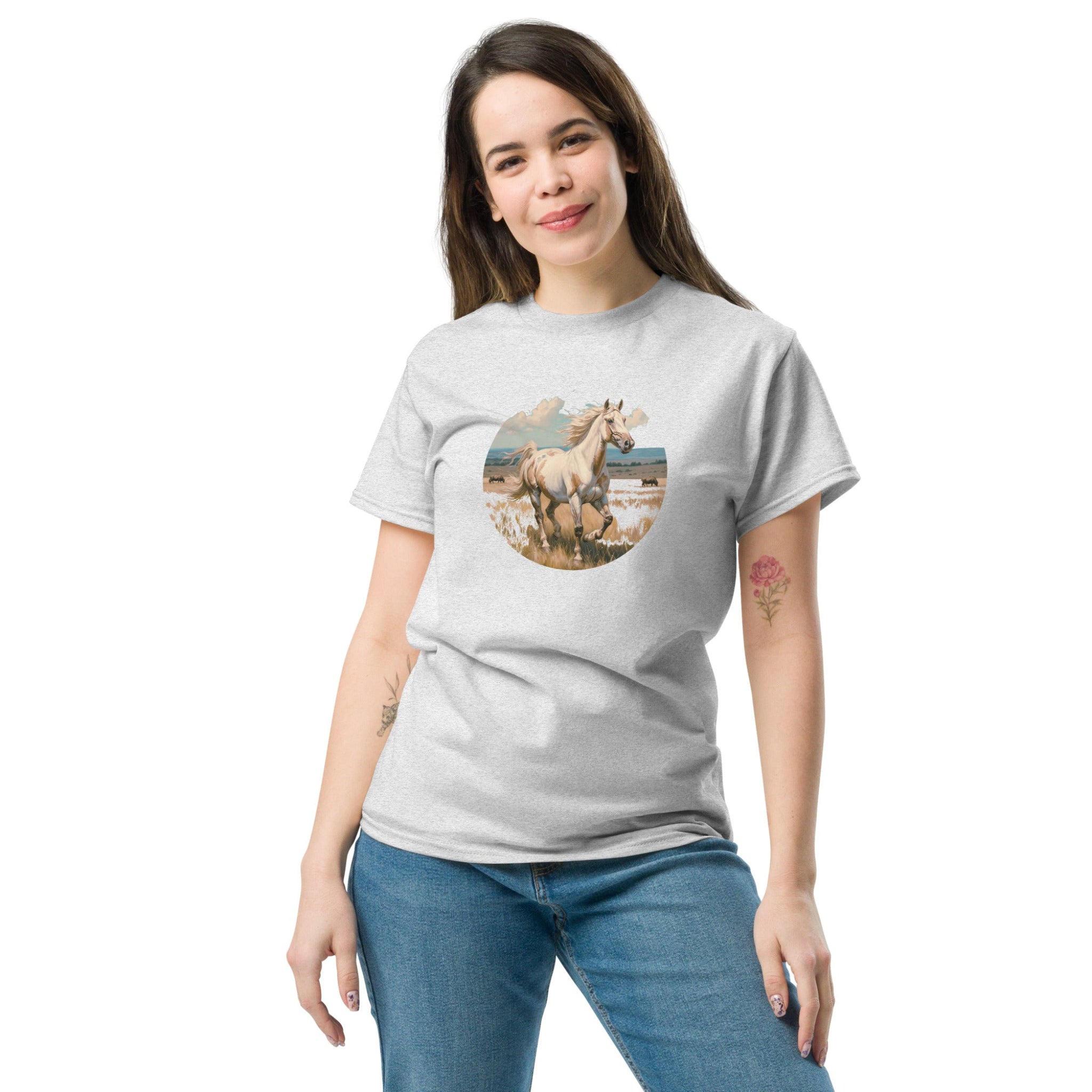 Woman wearing a gray t-shirt with a colorful graphic design on a white background