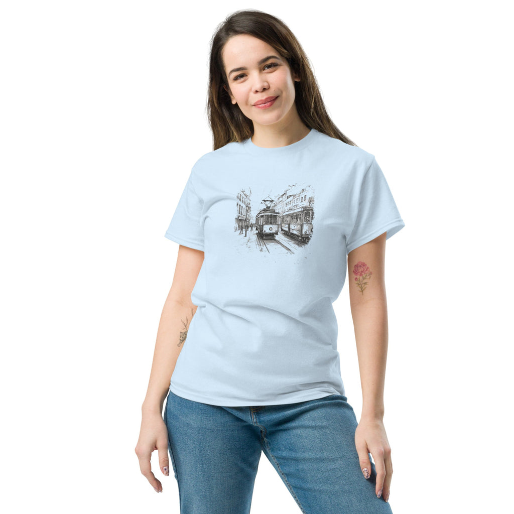 Woman wearing a light blue t-shirt with a tram sketch design on a white background
