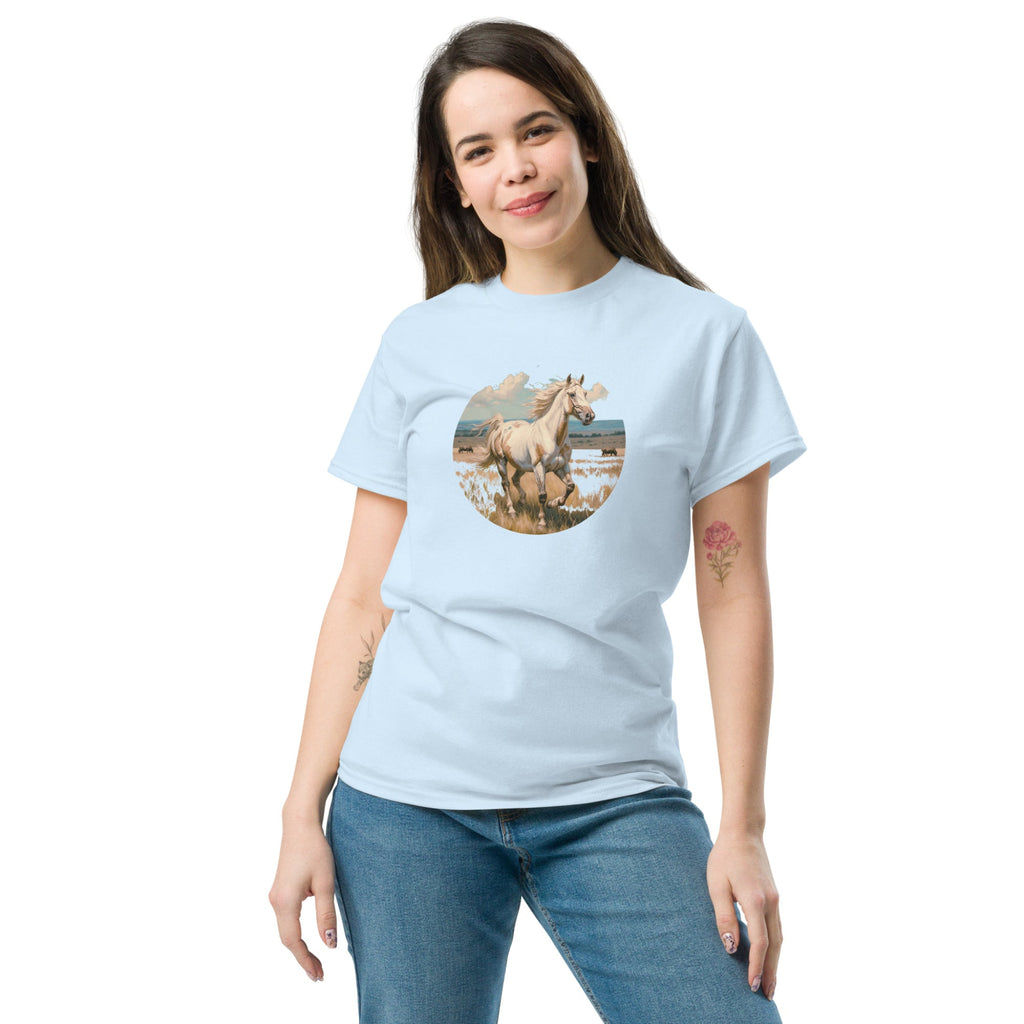 A person wearing a light blue t-shirt with a vintage-style illustration of an American Paint Horse running free, perfect for Western and equestrian fashion.