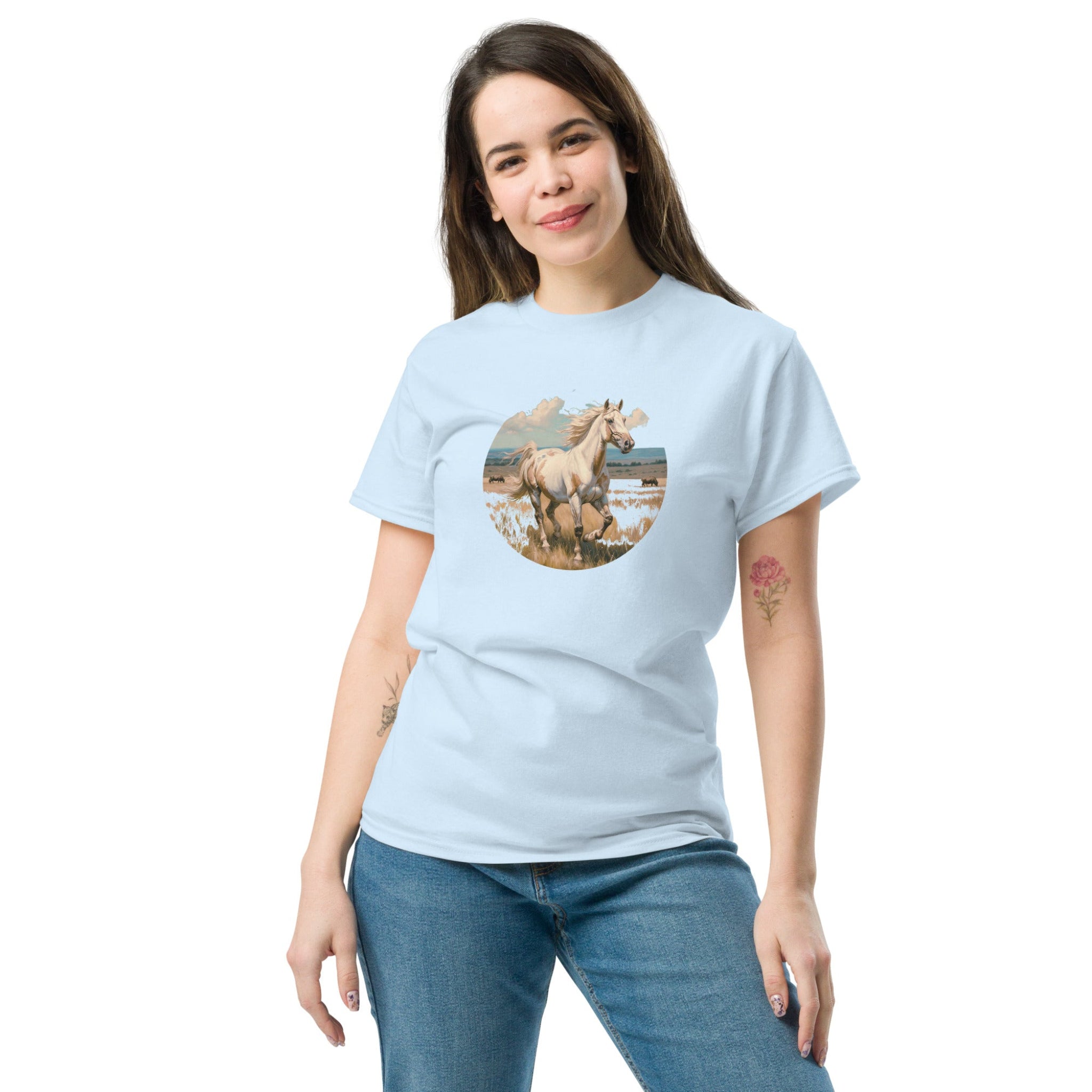 A person wearing a light blue t-shirt with a vintage-style illustration of an American Paint Horse running free, perfect for Western and equestrian fashion.