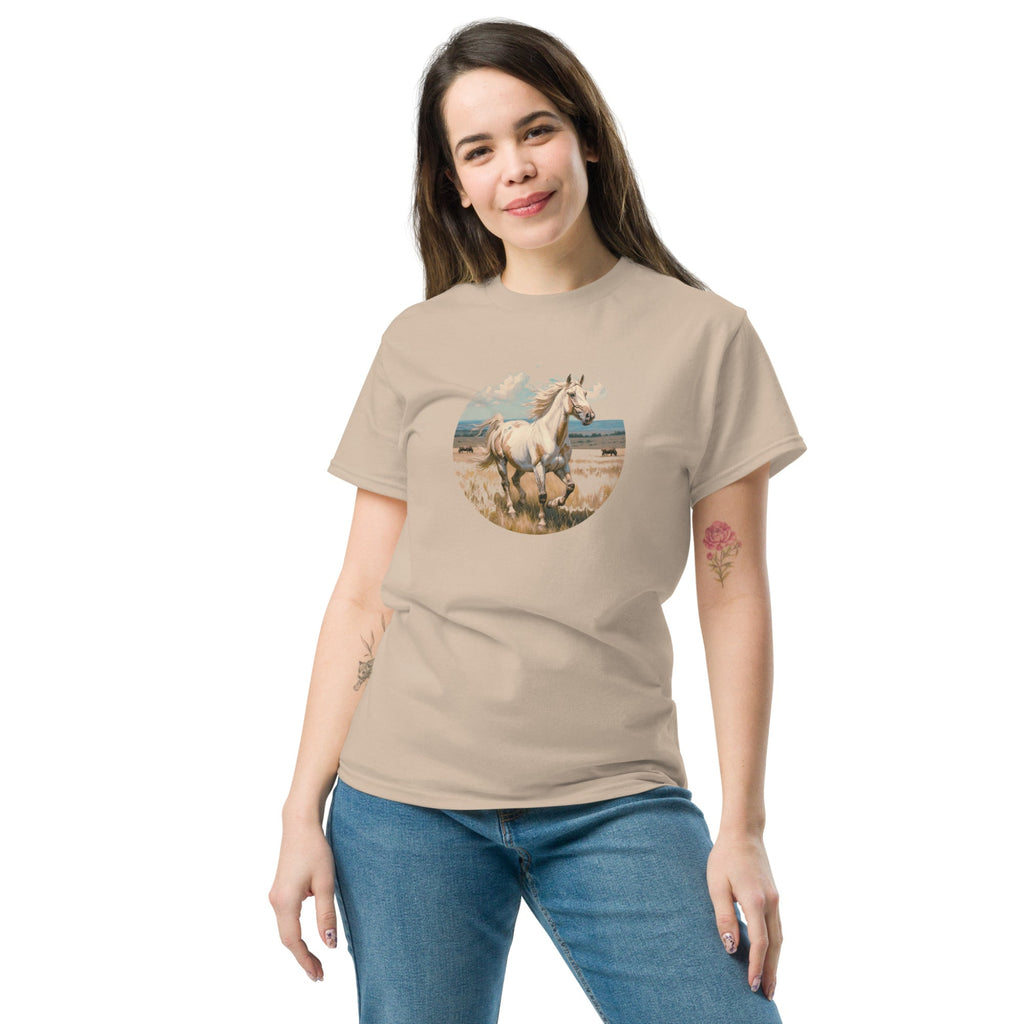 A person wearing a tan t-shirt with a vintage-style illustration of an American Paint Horse running free, perfect for Western and equestrian fashion.