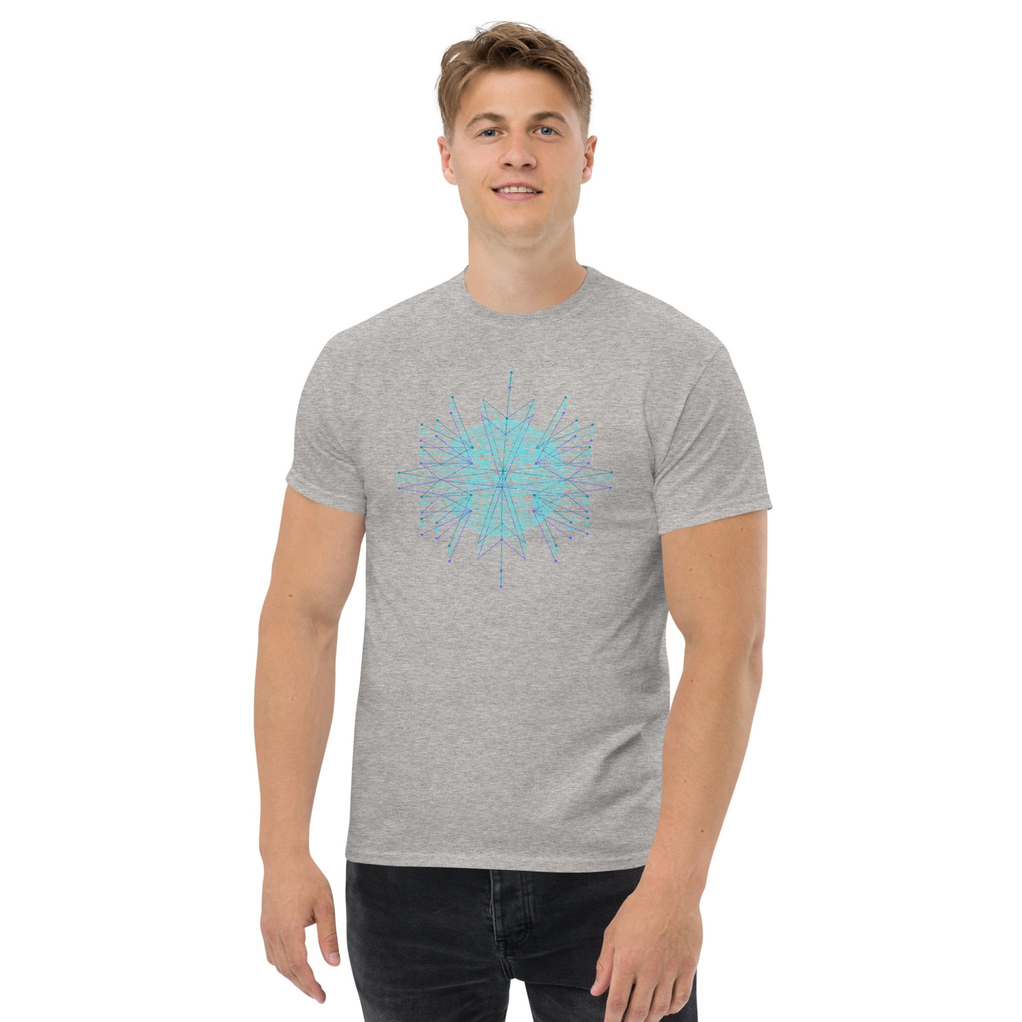 Man wearing a gray t-shirt with a blue geometric design on a white background