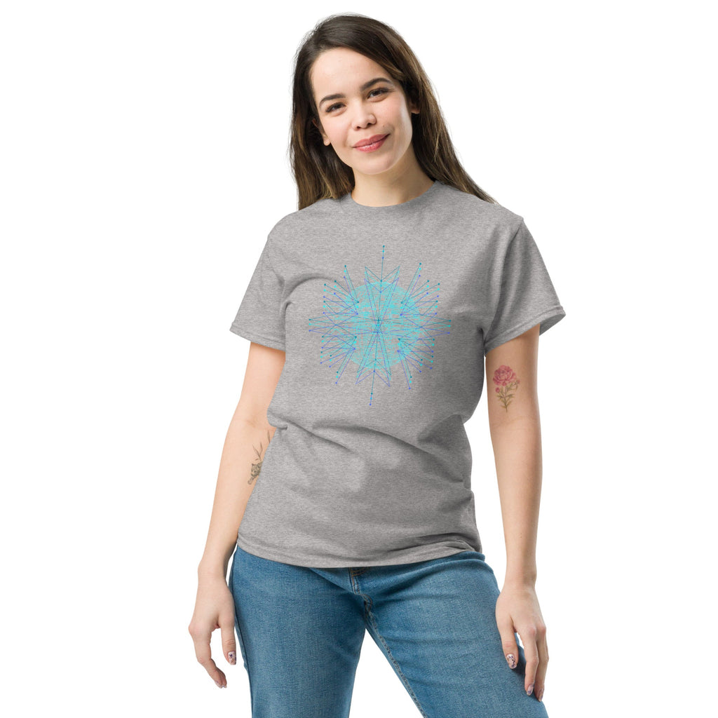 Woman wearing al ight gray t-shirt with a  blue geometric sun design on a white background