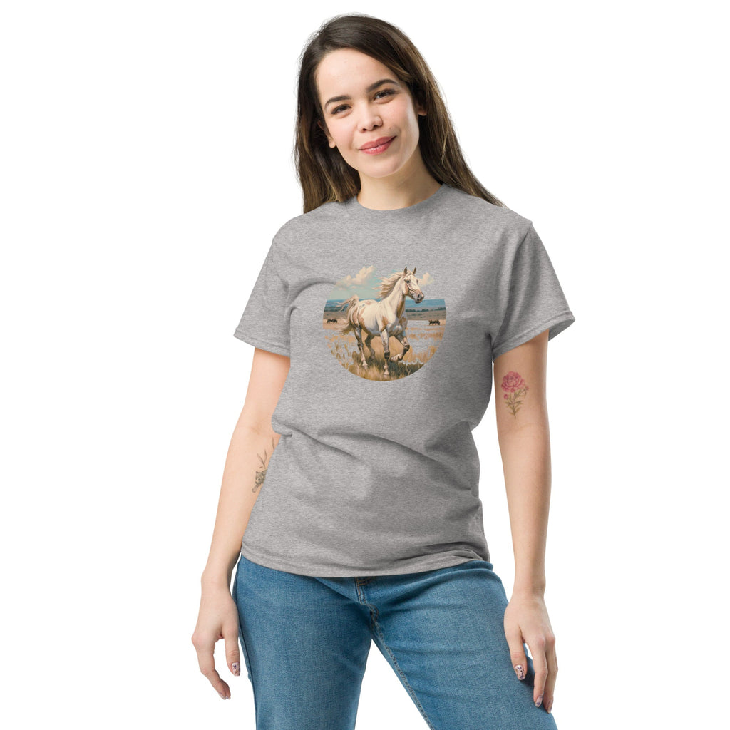 A person wearing a grey t-shirt with a vintage-style illustration of an American Paint Horse running free, perfect for Western and equestrian fashion.