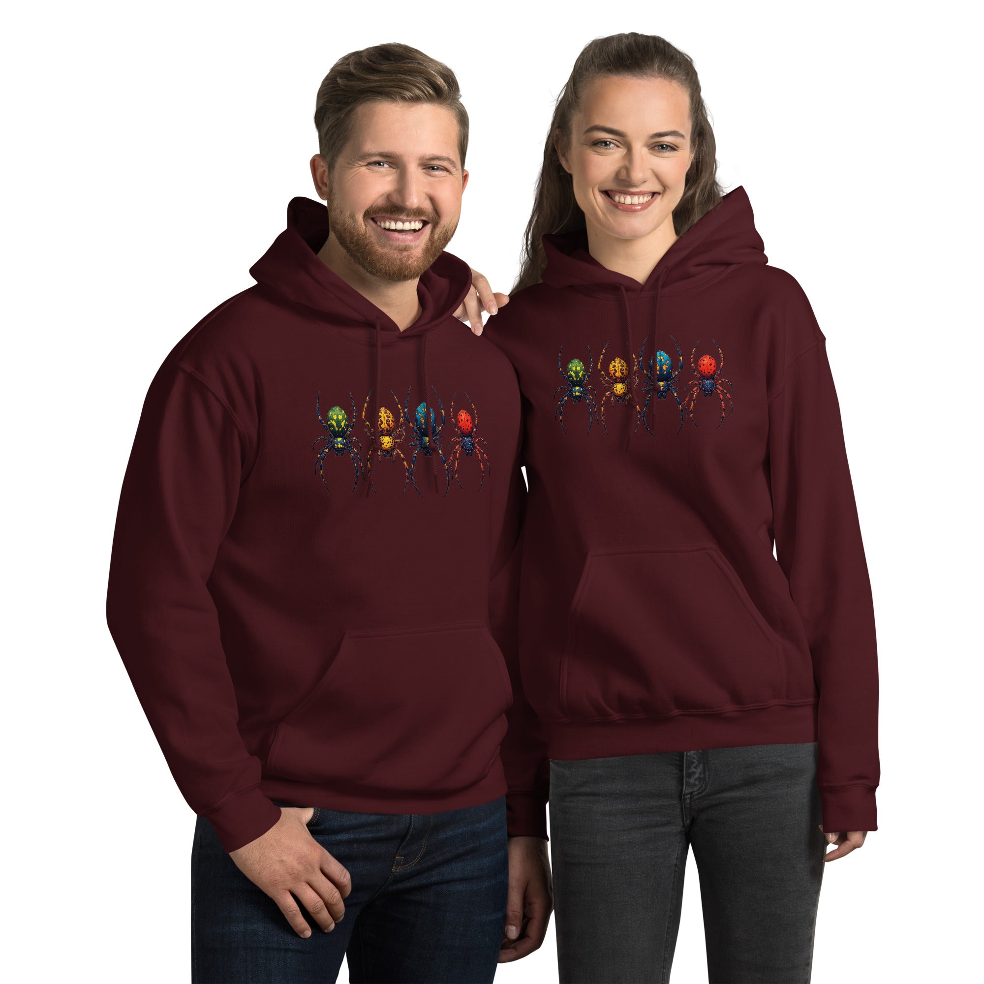 A man and a woman modeling matching maroon hoodies with a graphic of four colorful spiders across the chest, set against a plain white background.