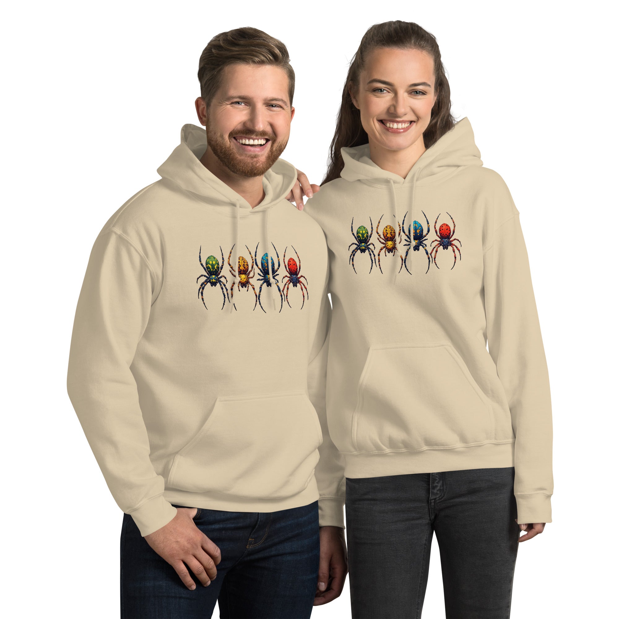A man and a woman modeling matching beige hoodies with a graphic of four colorful spiders across the chest, set against a plain white background.