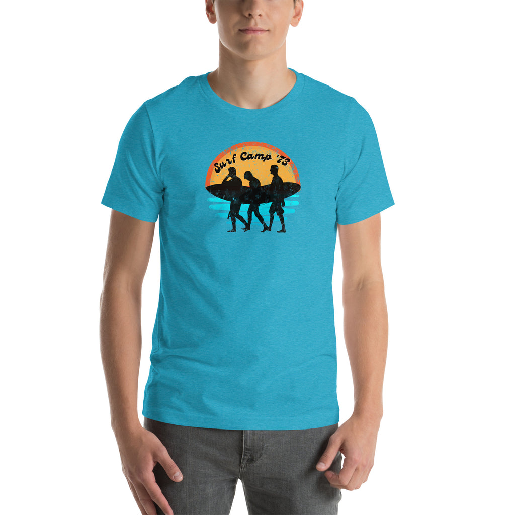 Person wearing a blue t-shirt with a graphic design on a white background.