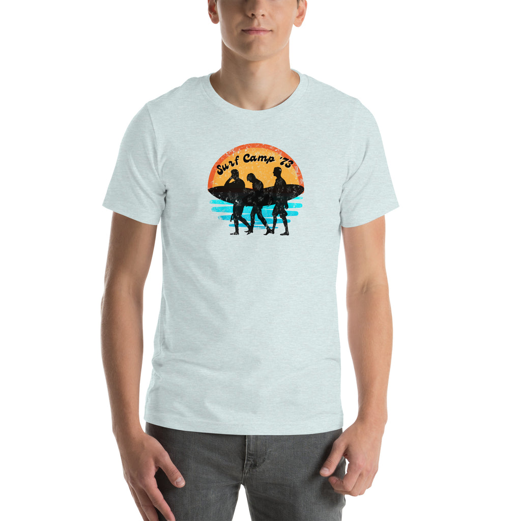 Person wearing a light blue t-shirt with a graphic design on a white background.