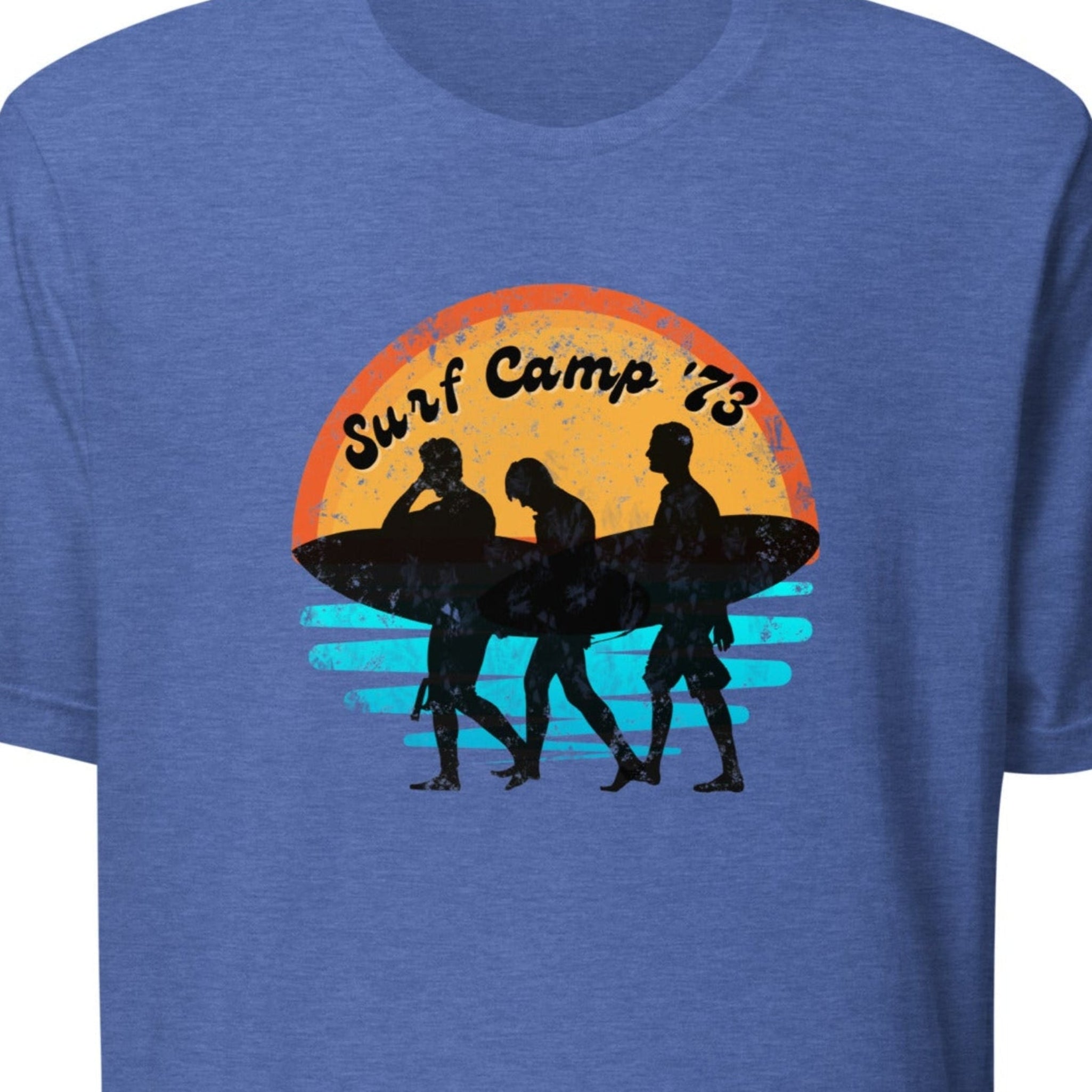 Blue t-shirt with 'Surf Camp 73' graphic on a white background.