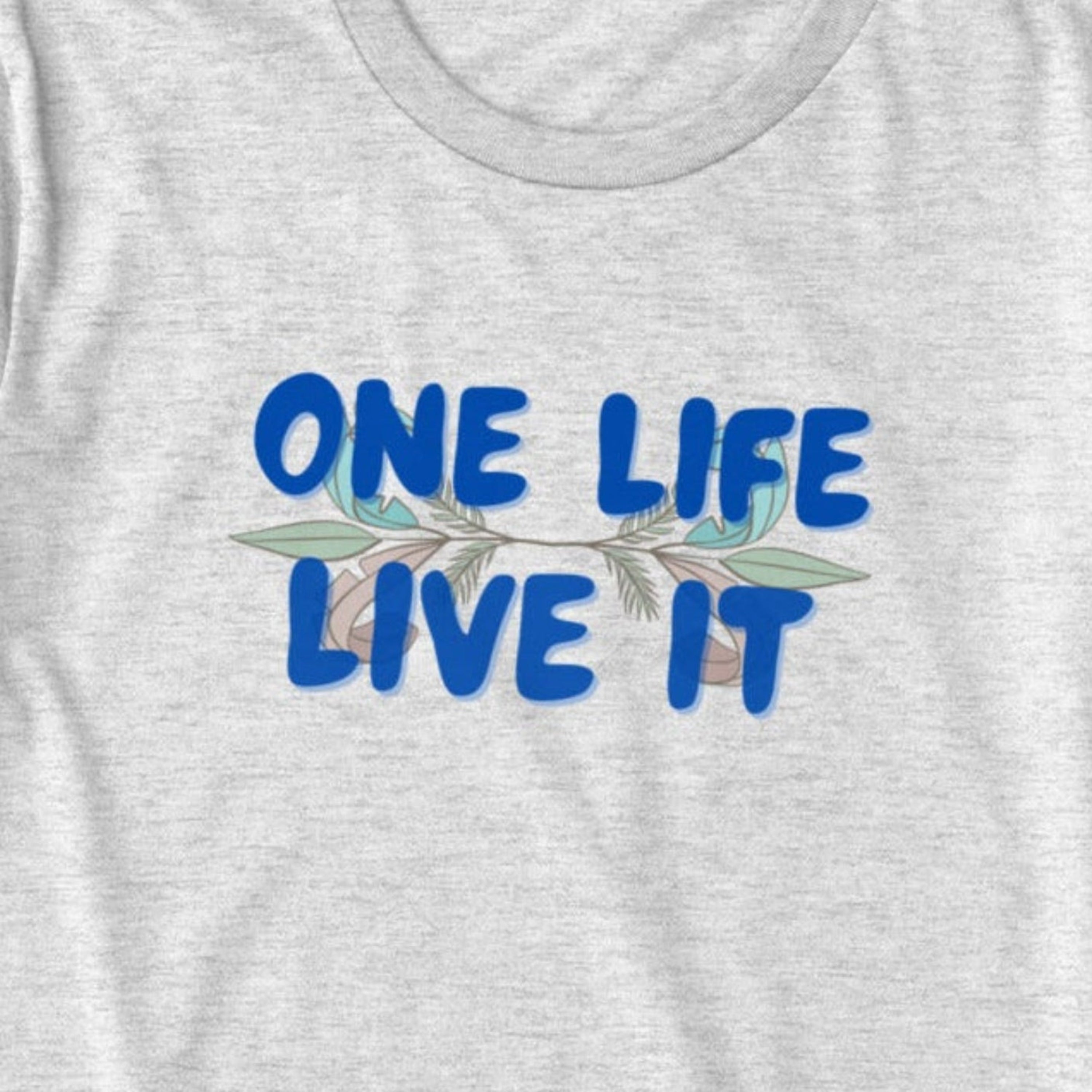 Gray t-shirt with 'ONE LIFE LIVE IT' text on a pink background