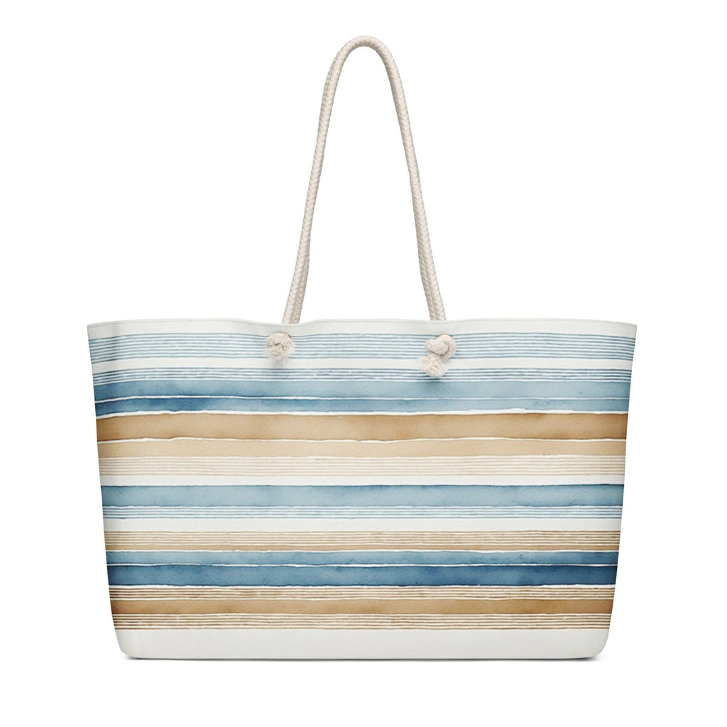 Striped beach bag with blue and beige pattern on a white background