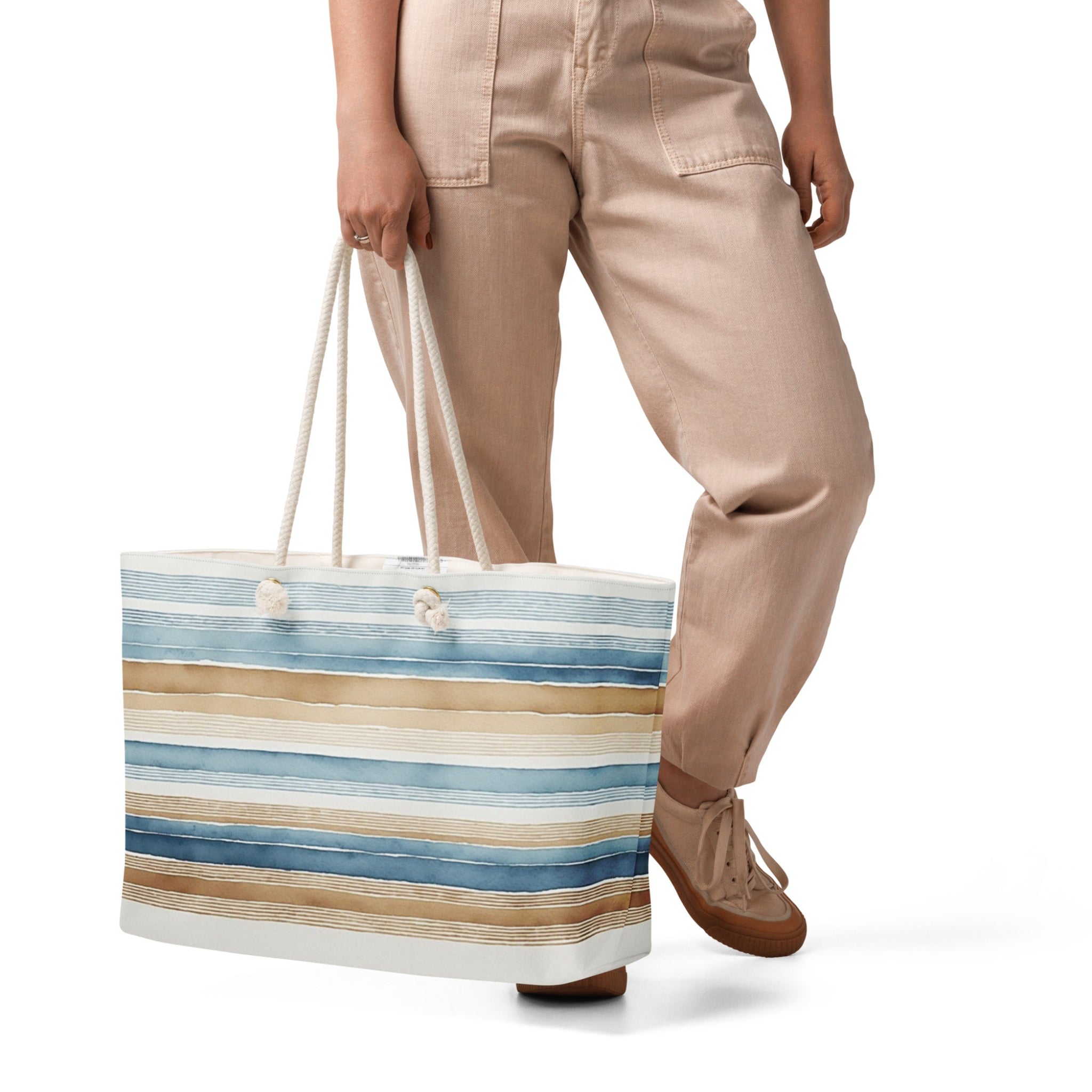 Oversized nautical weekender tote bag with blue and tan watercolor stripes and thick cream rope handles