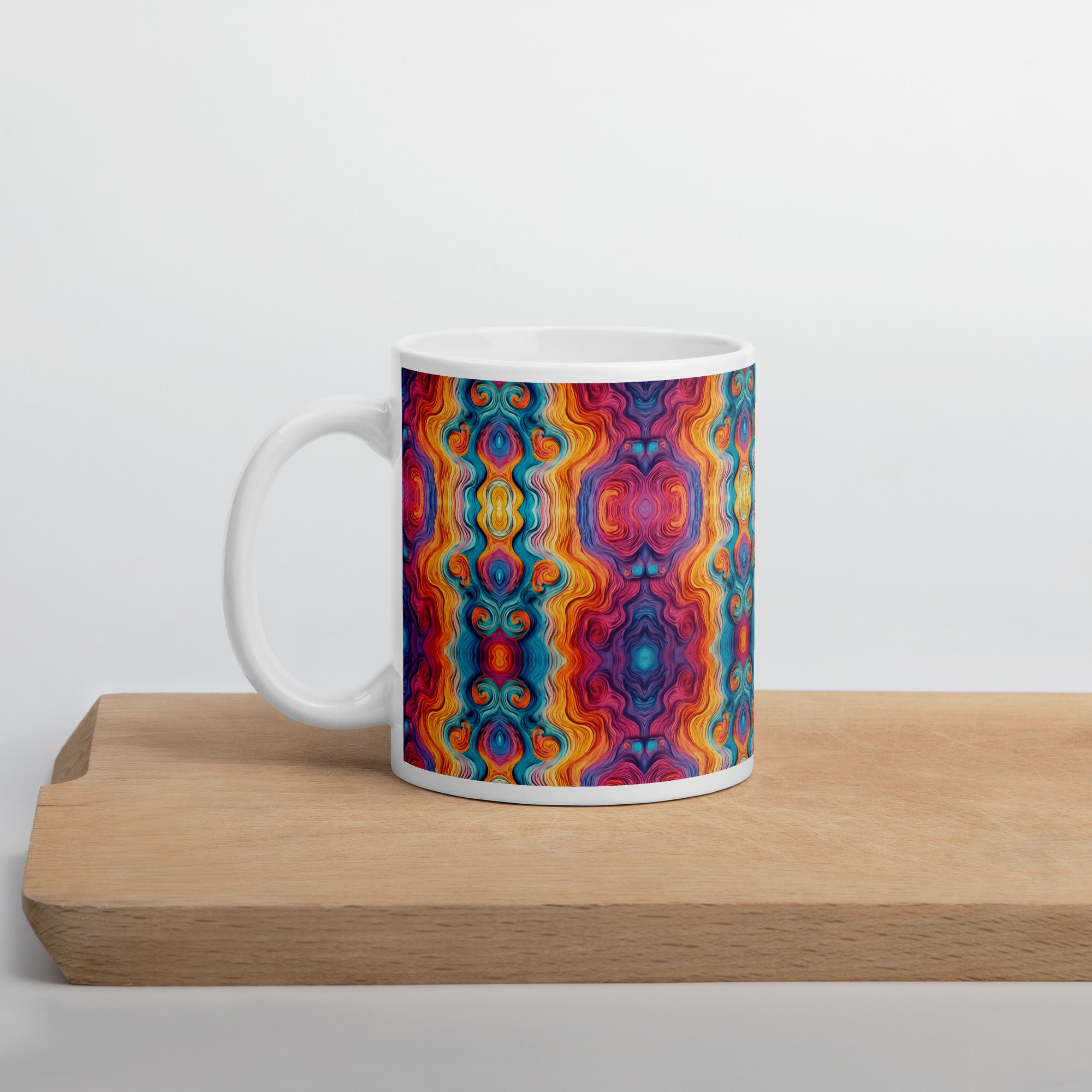 Multicolored ceramic coffee cup on wood table