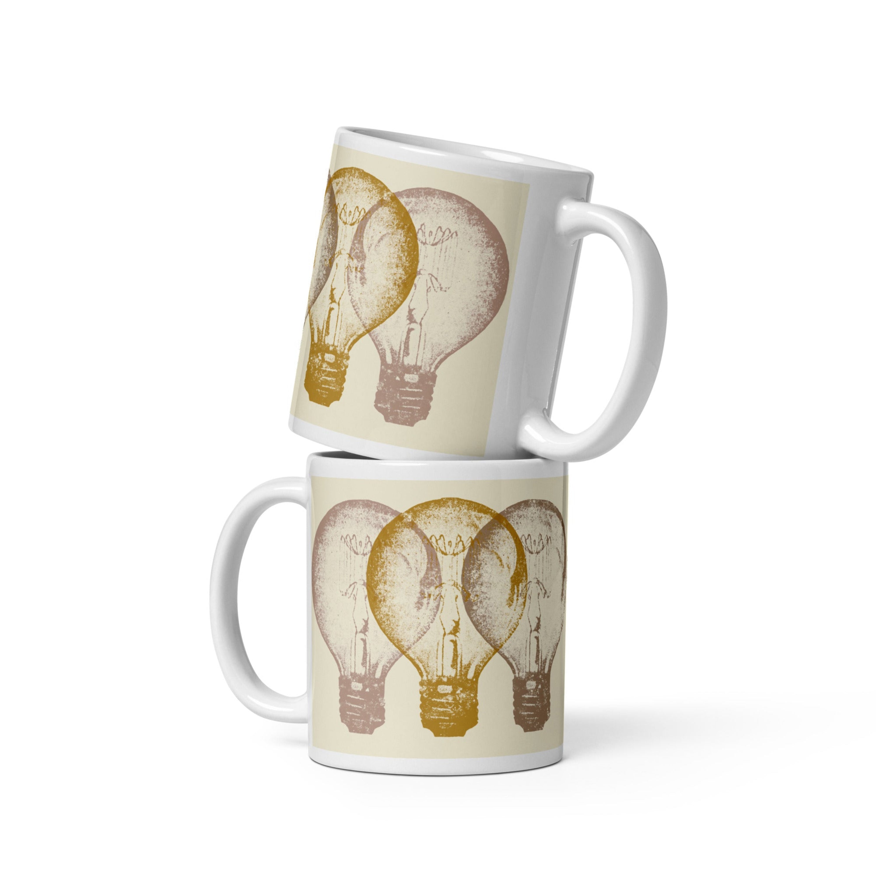 Two stacked mugs with vintage light bulb design on a white background