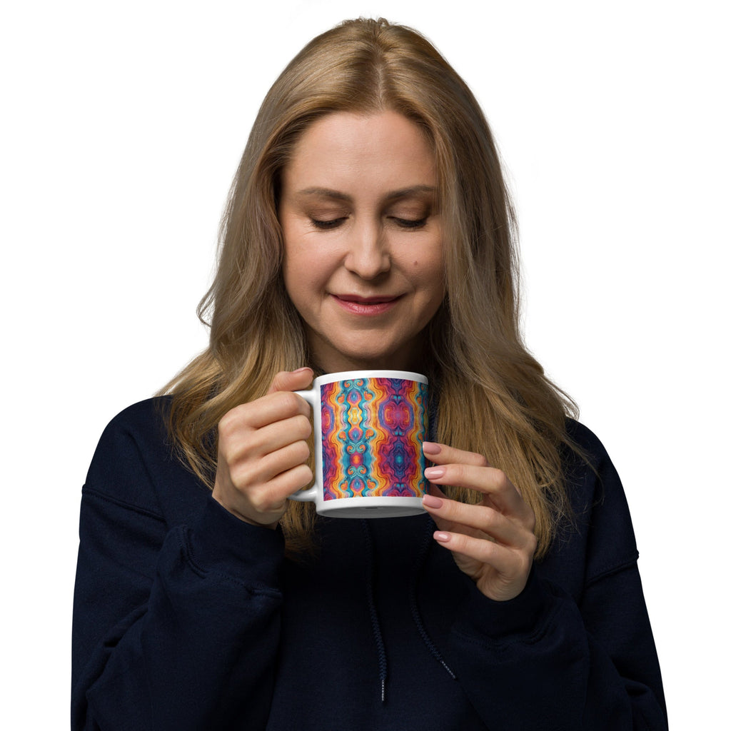 Woman holding a multicolored ceramic coffee mug