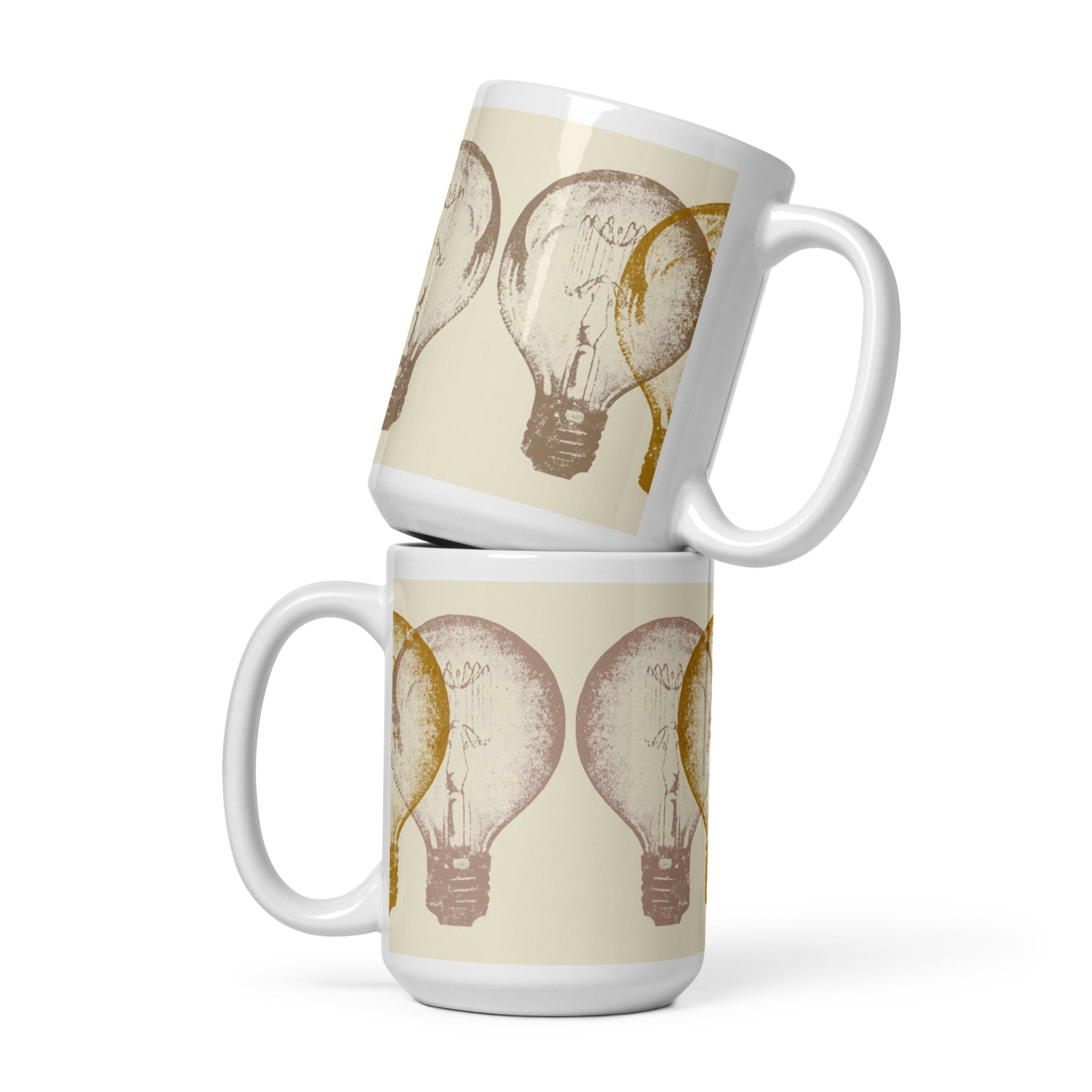 Two stacked mugs with light bulb design on a beige background