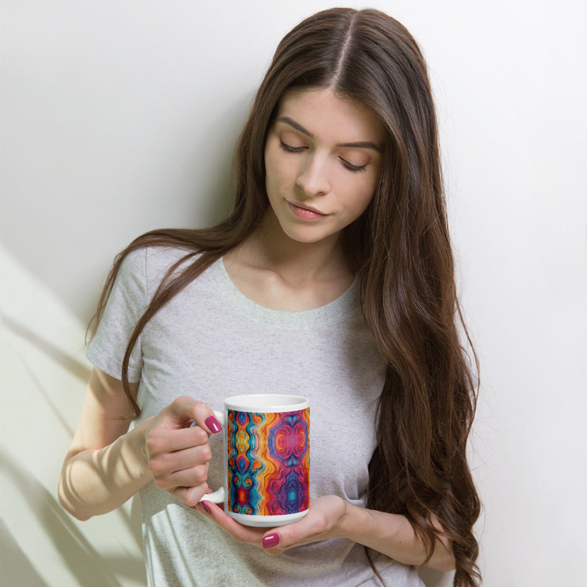 Woman holding a multicolored ceramic coffee mug