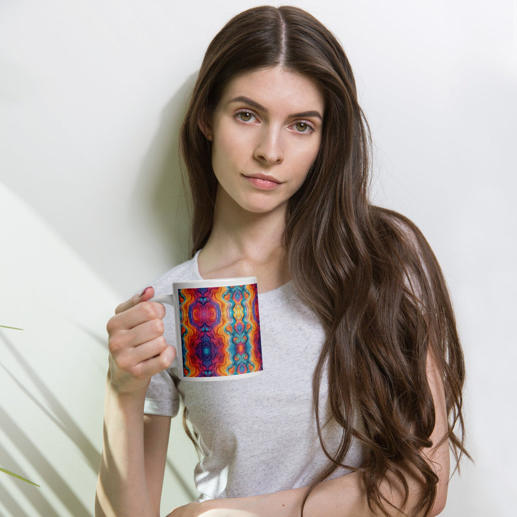Woman holding a multicolored ceramic coffee mug