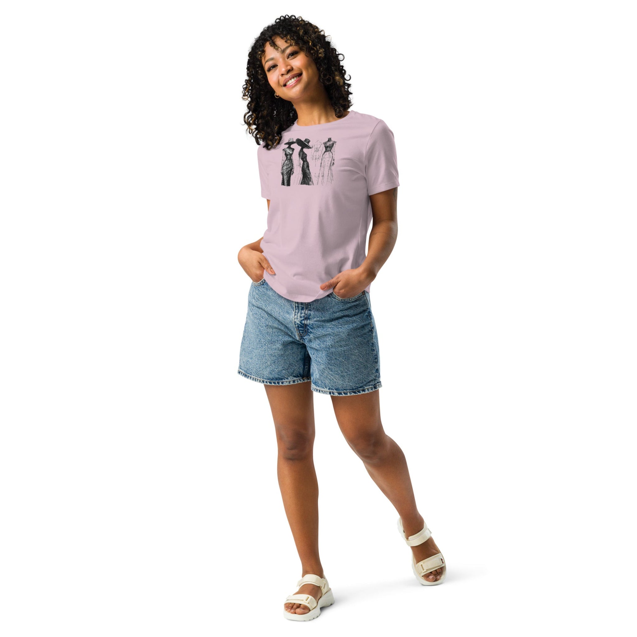 Woman wearing a mauve t-shirt with a vintage style fashion sketch design, paired with denim shorts on a white background.